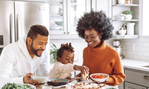 a family cooking together